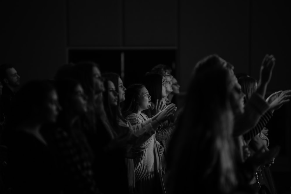 grayscale photo of woman in long sleeve shirt