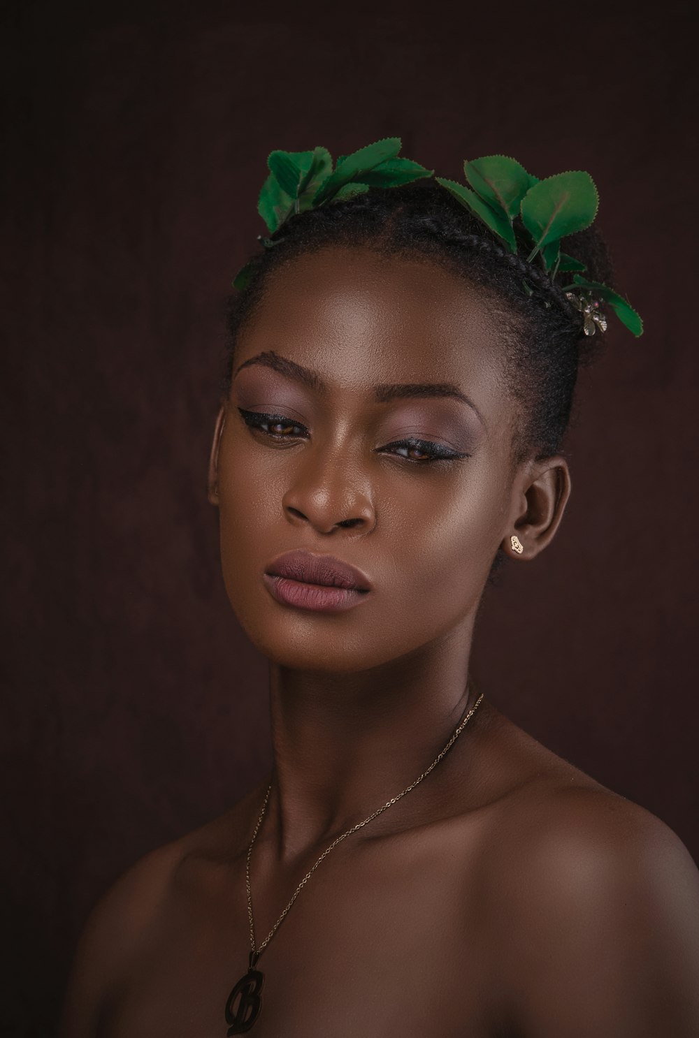 woman with green rose on her head