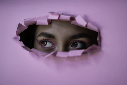 woman in pink hijab taking selfie