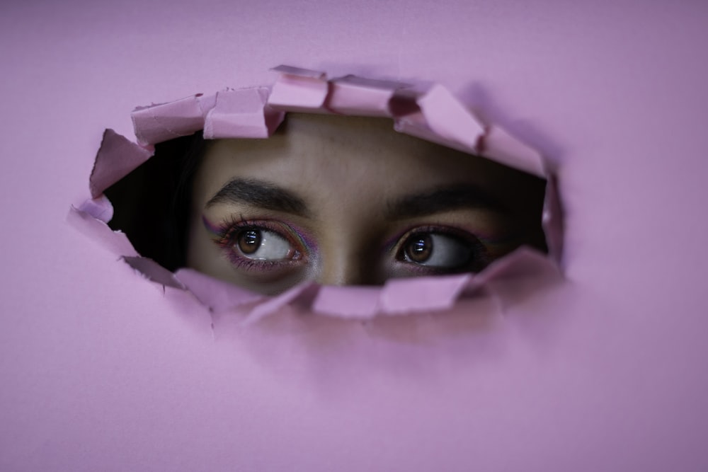 woman in pink hijab taking selfie