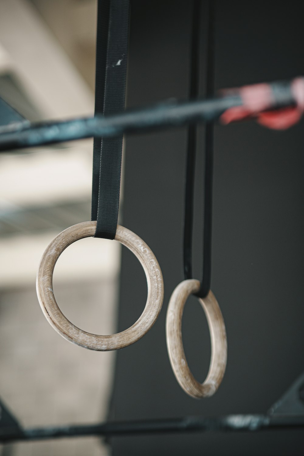 gold ring on black metal fence