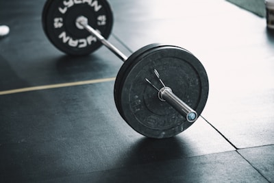Heavy-duty barbell loaded with weight plates, ready for lifting.