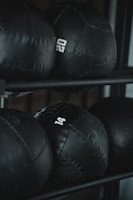 black leather boxing gloves on rack