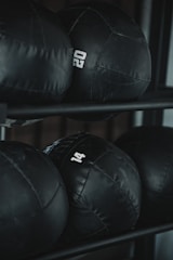 black leather boxing gloves on rack