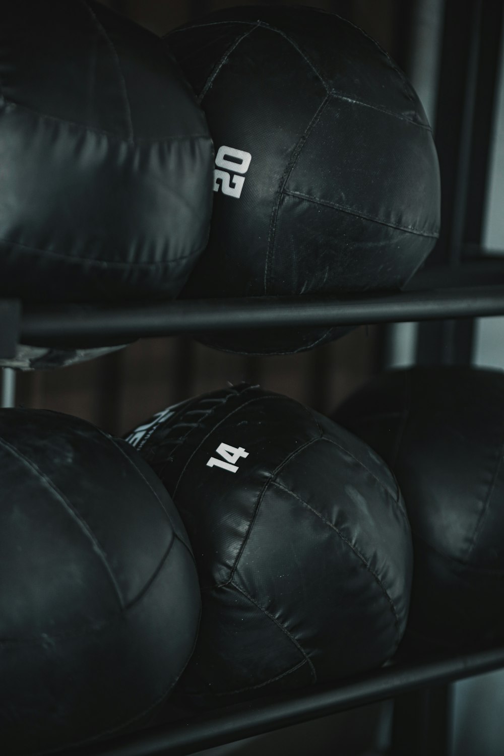 black leather boxing gloves on rack