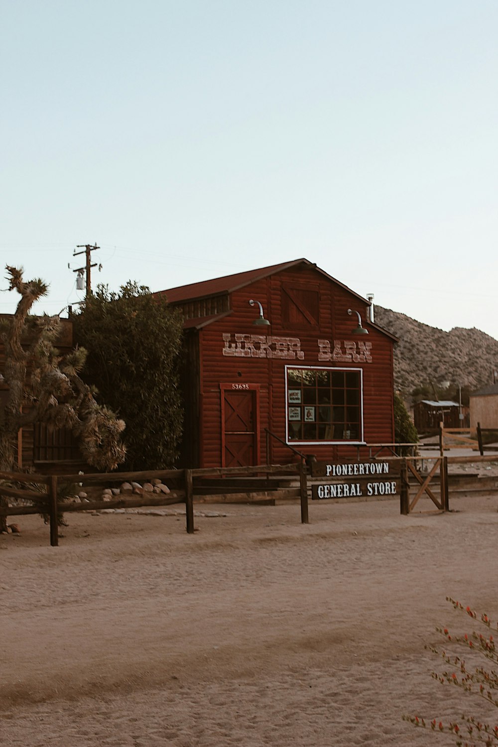 a red building with a sign in front of it