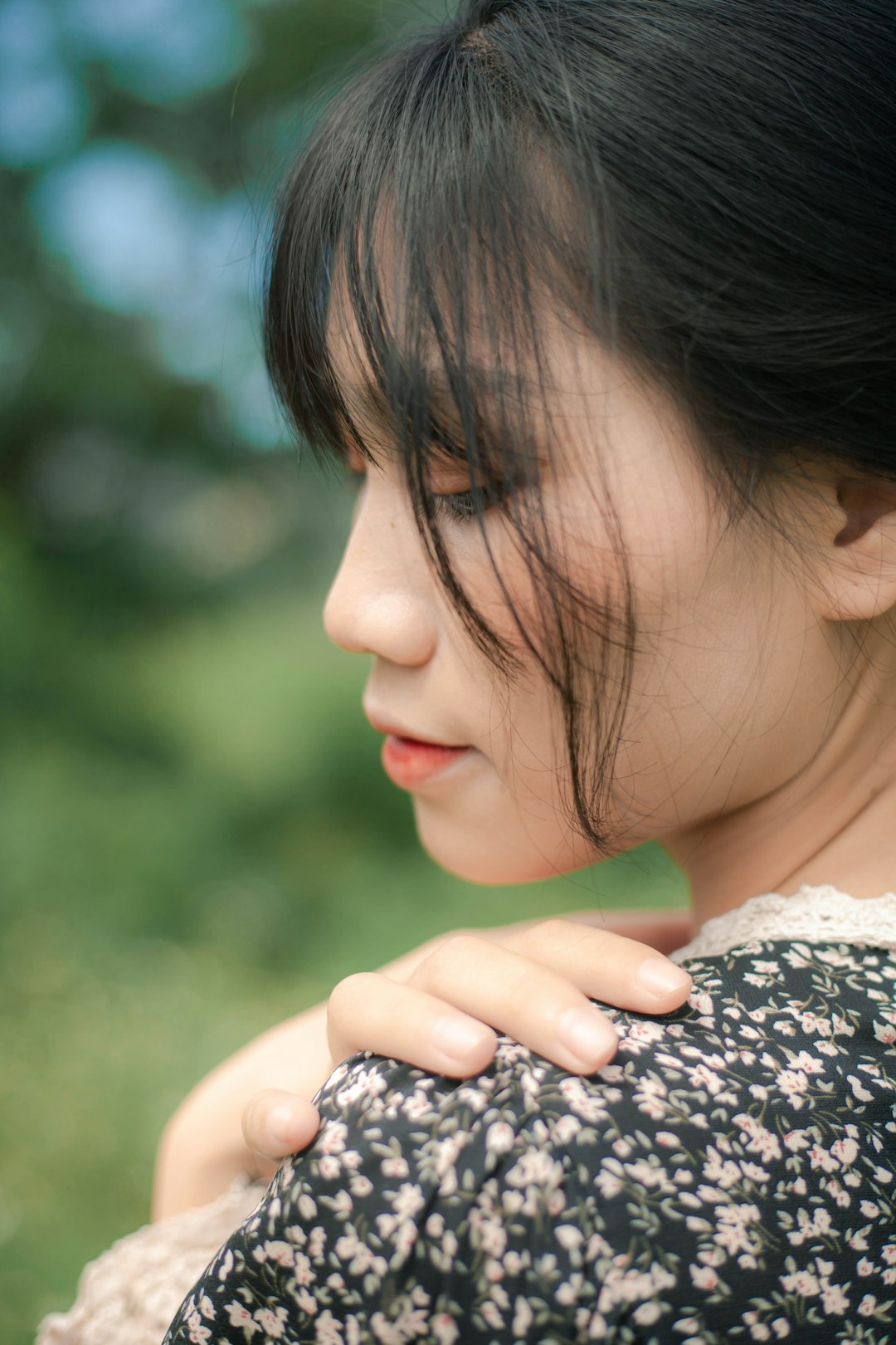 girl in black and white floral dress