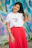woman in white crew neck t-shirt and red skirt