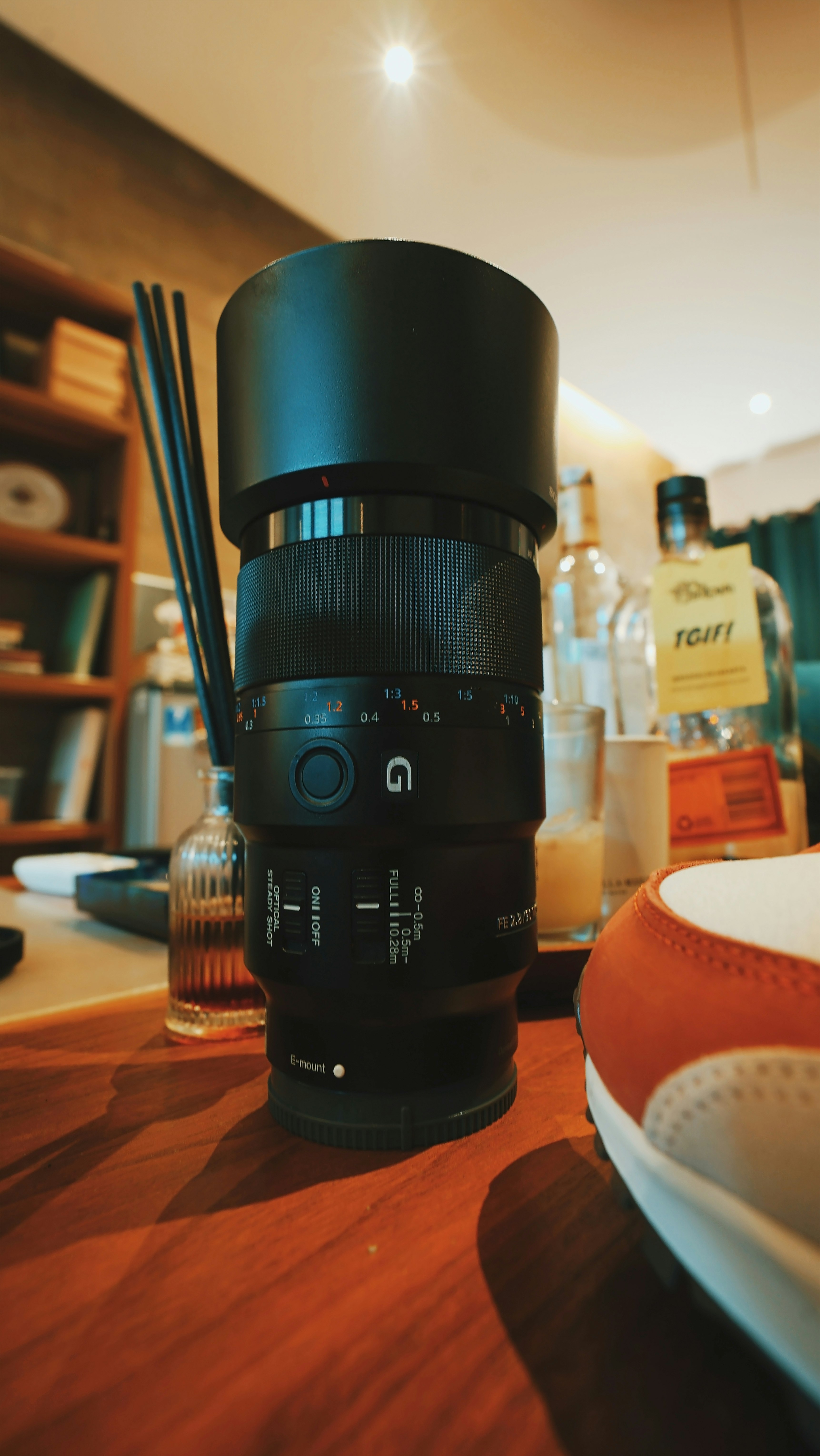 black camera lens on brown wooden table