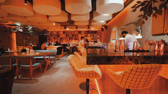 A cozy restaurant bar with modern tech devices subtly integrated.
