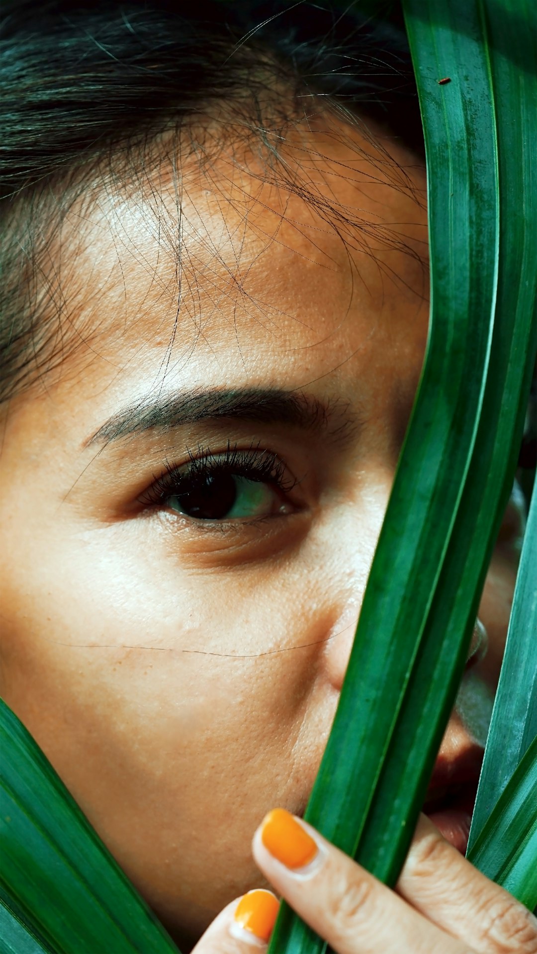 girl in green shirt with green plastic frame