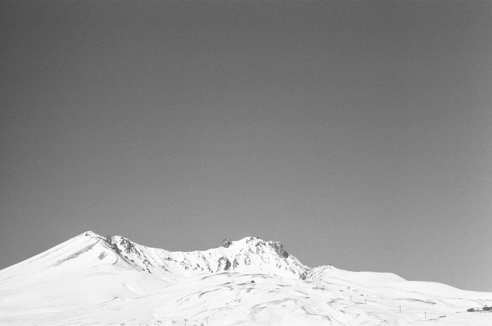 snow covered mountain during daytime