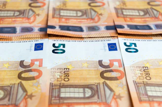 50 euro bill on brown wooden table