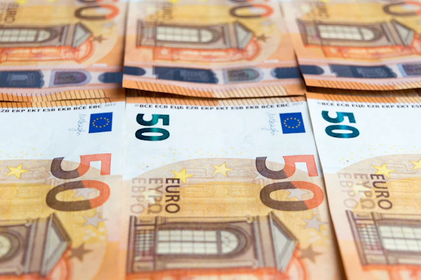 50 euro bill on brown wooden table