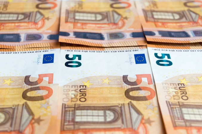 50 euro bill on brown wooden table