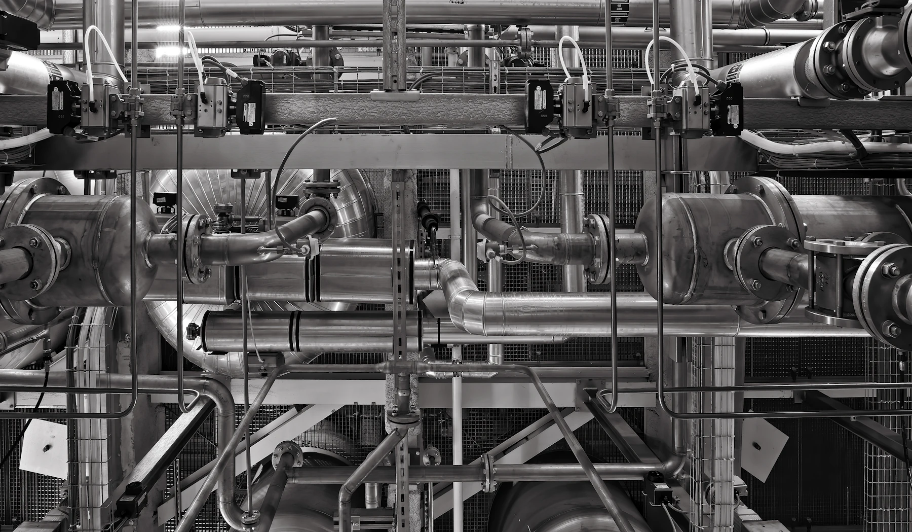 Insulated process pipework running through an industrial plant