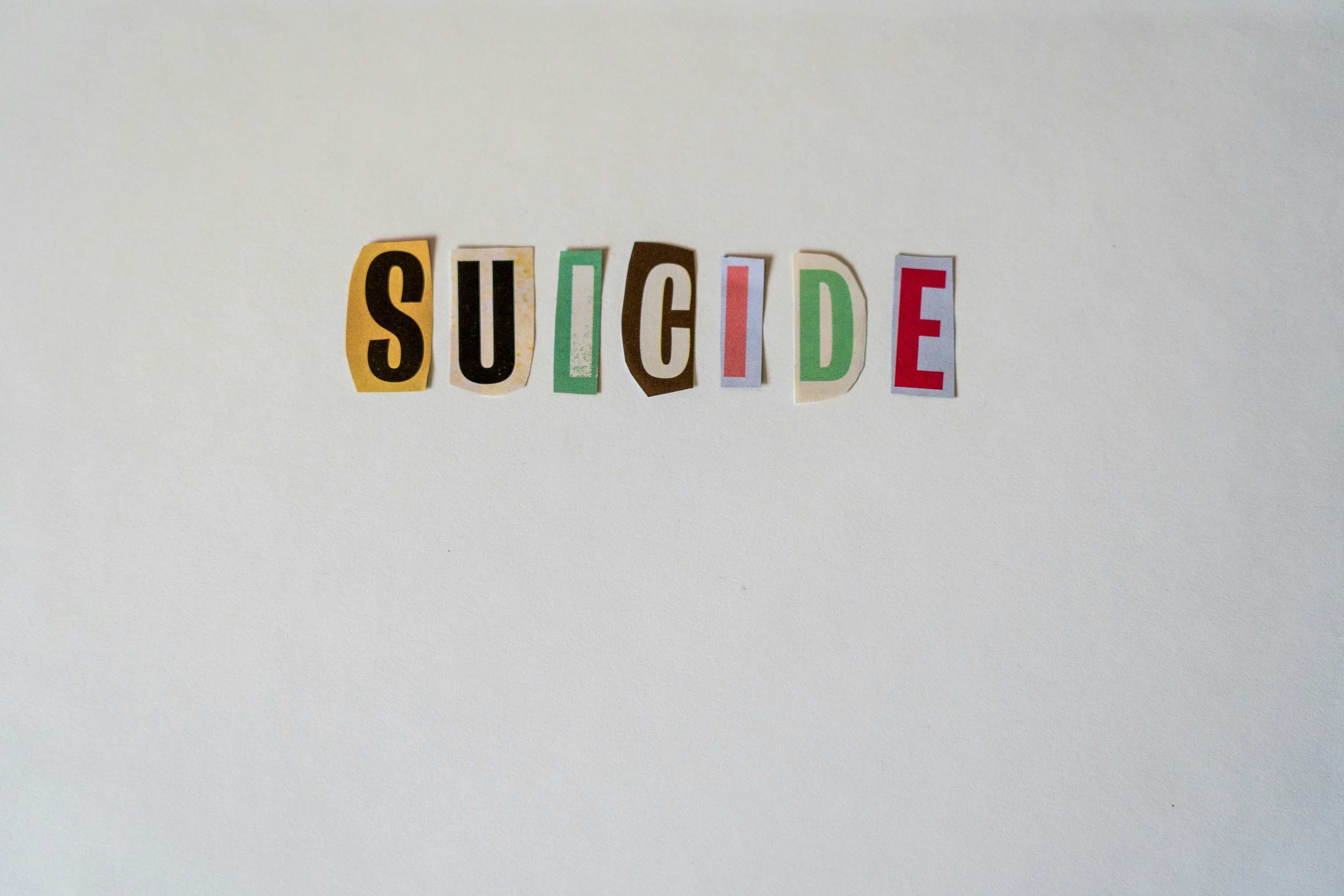 Suicide, cut out of letters from a magazine.