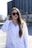 woman in white dress shirt wearing black sunglasses
