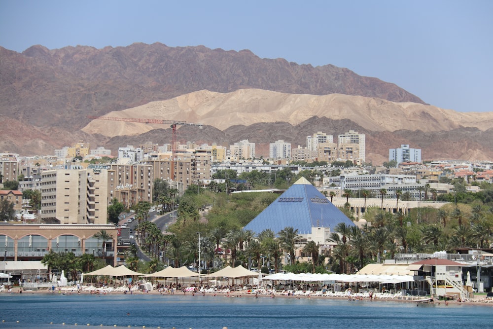 white and brown buildings near body of water during daytime