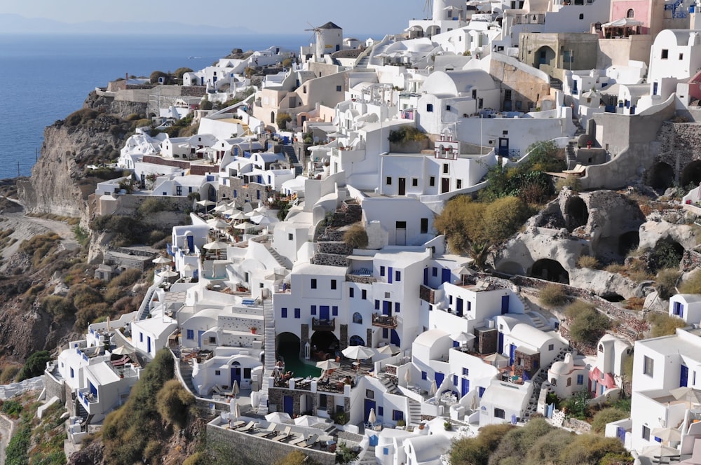 white concrete houses on hill during daytime