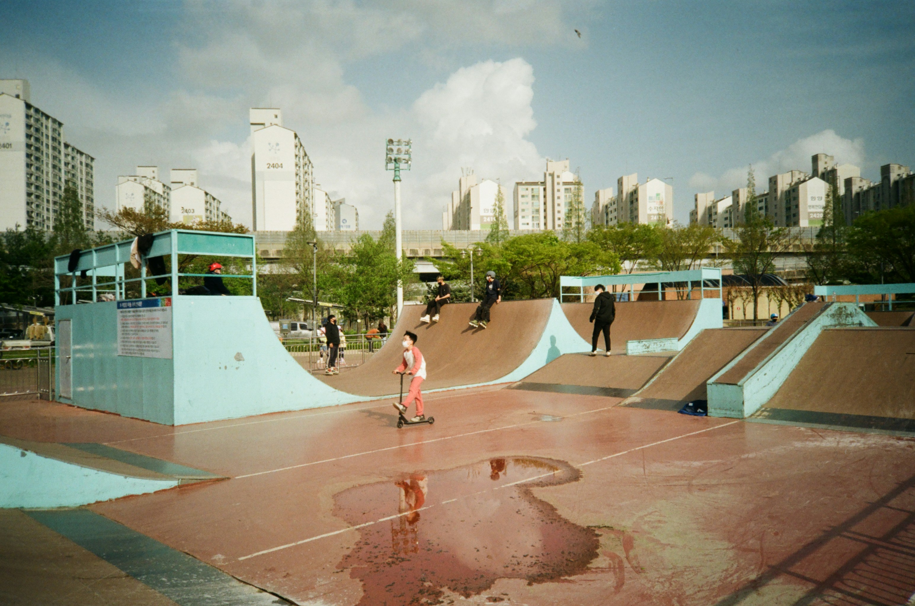 woman in pink dress jumping on the air