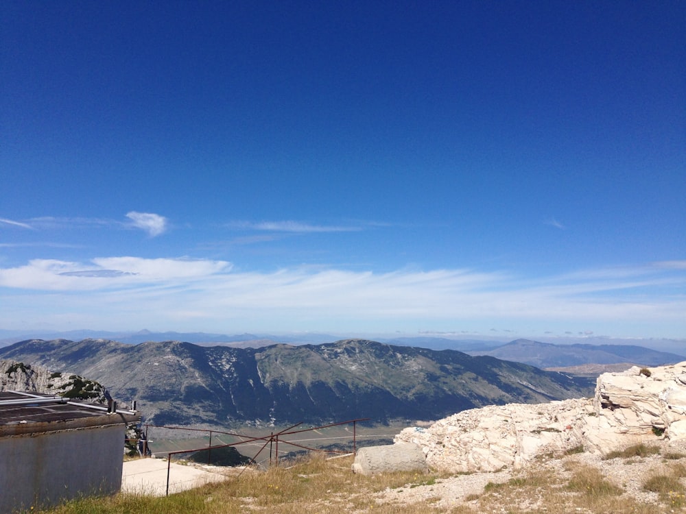 brown and green mountains under blue sky during daytime