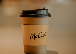 brown and black paper cup