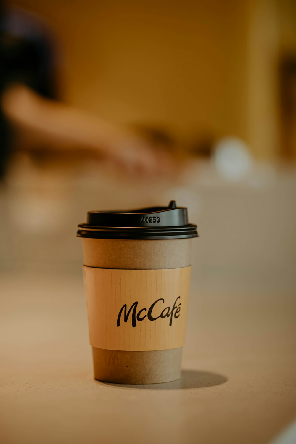 brown and black paper cup