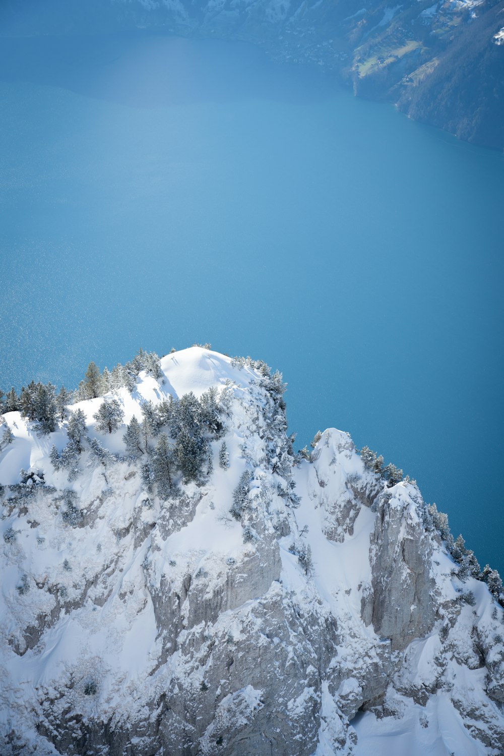 snow covered mountain under blue sky during daytime