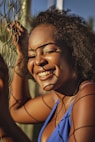 smiling woman in blue tank top