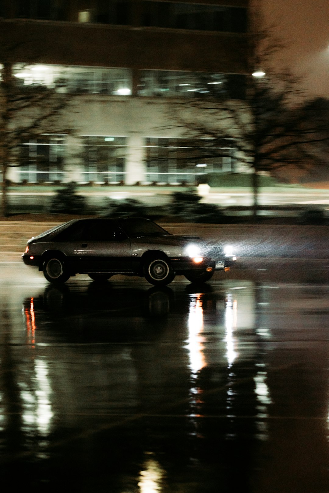 black sedan on road during night time