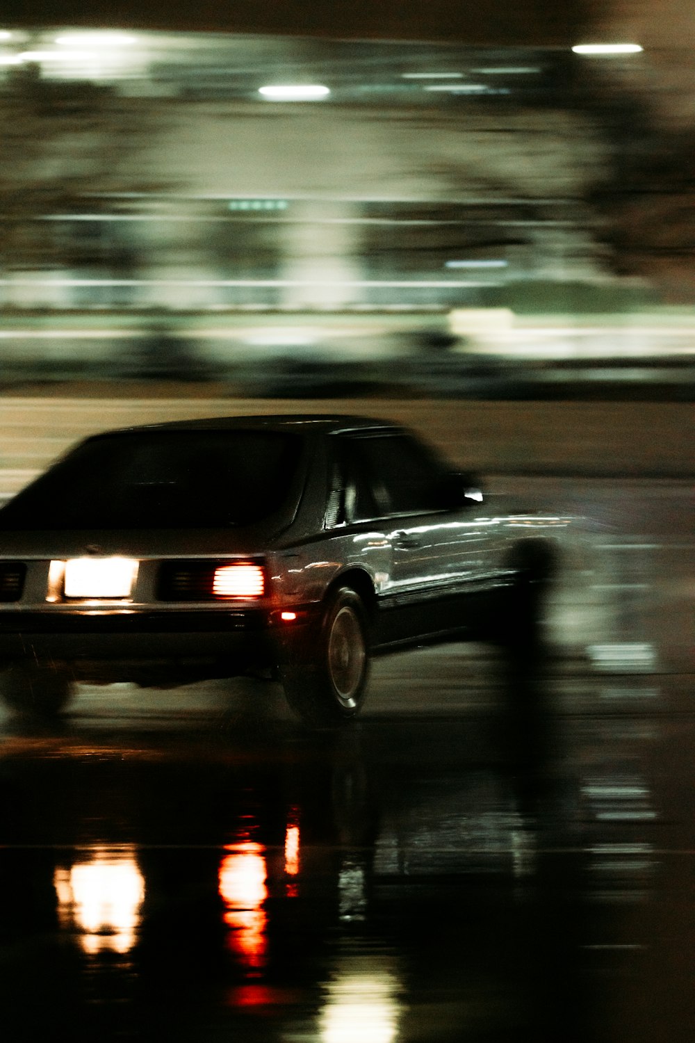 black sedan on road during daytime