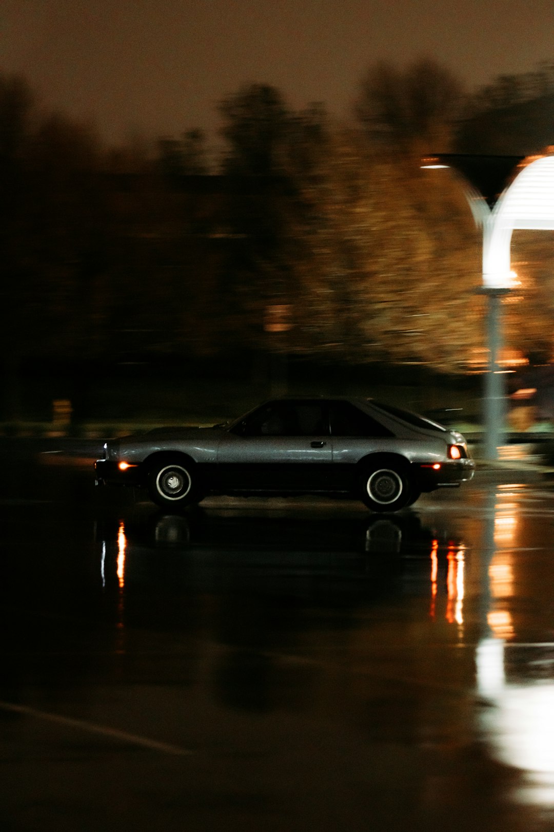 black sedan on road during night time