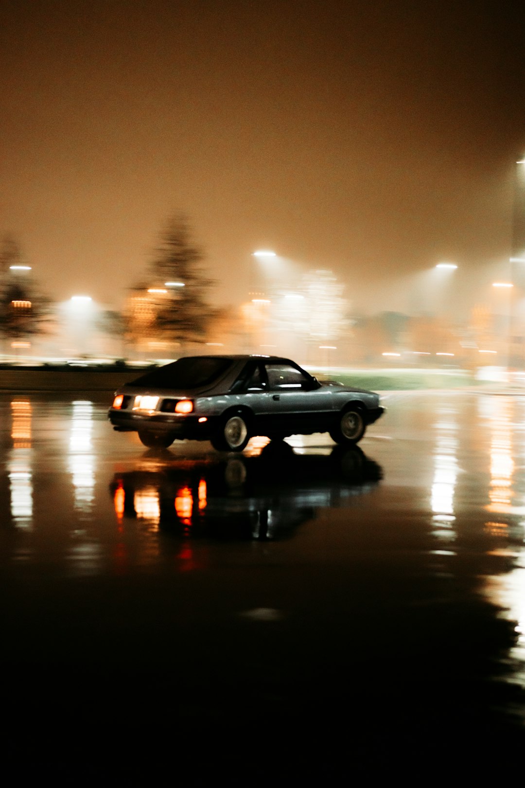 black sedan on road during night time