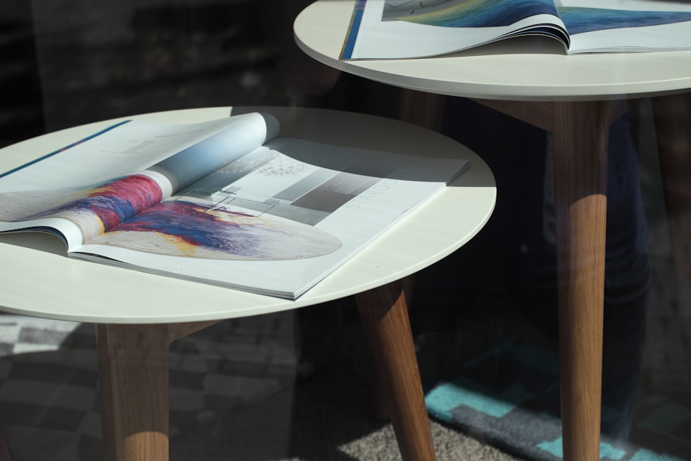 magazines on white wooden round table