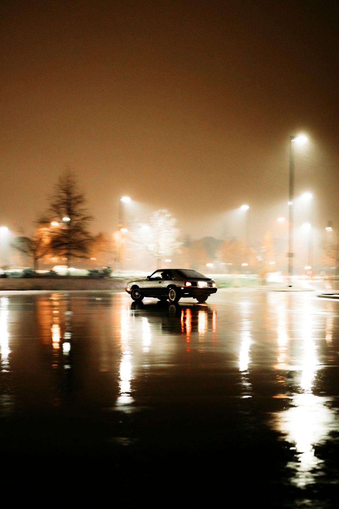 black sedan on road during night time