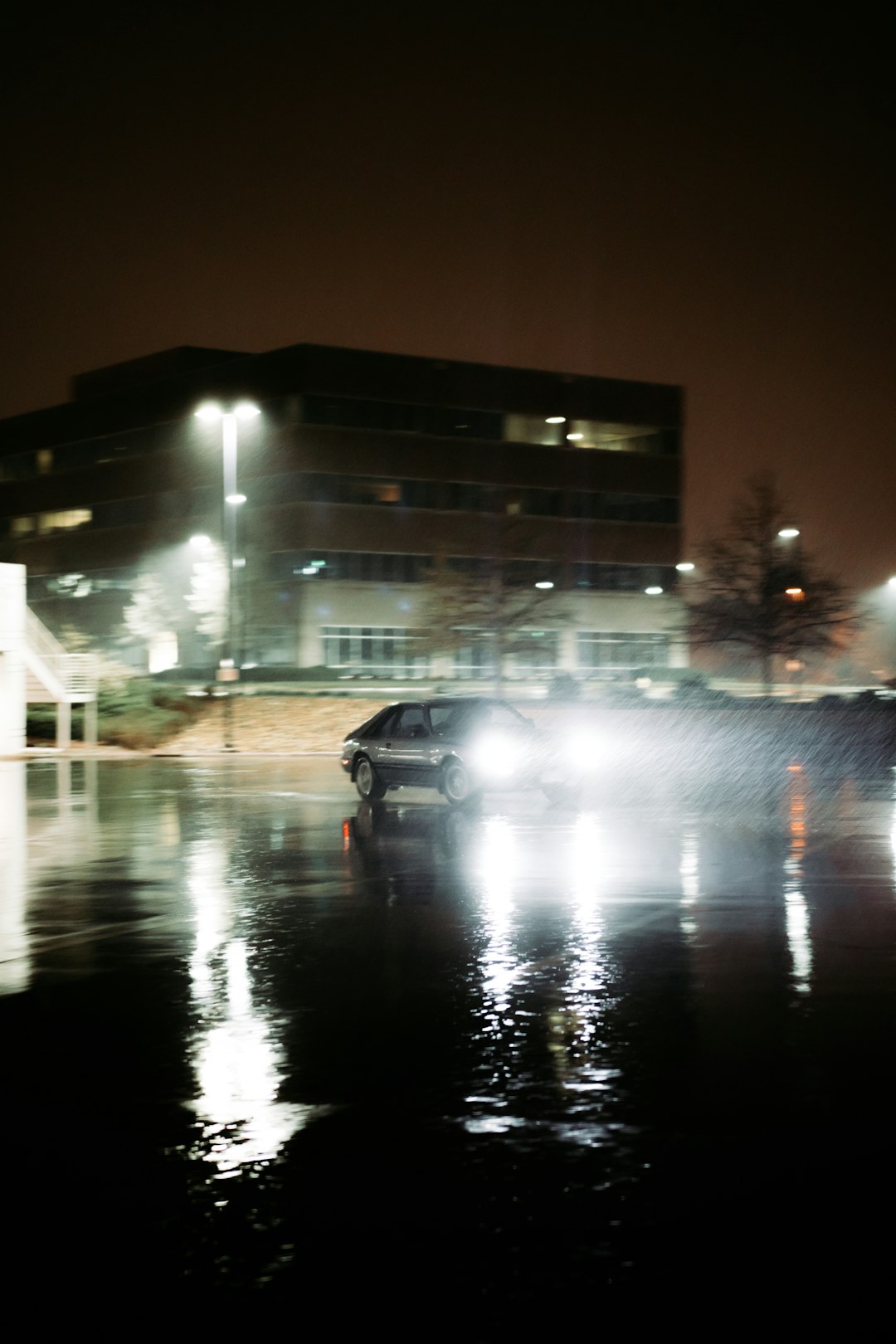 black car on road during night time