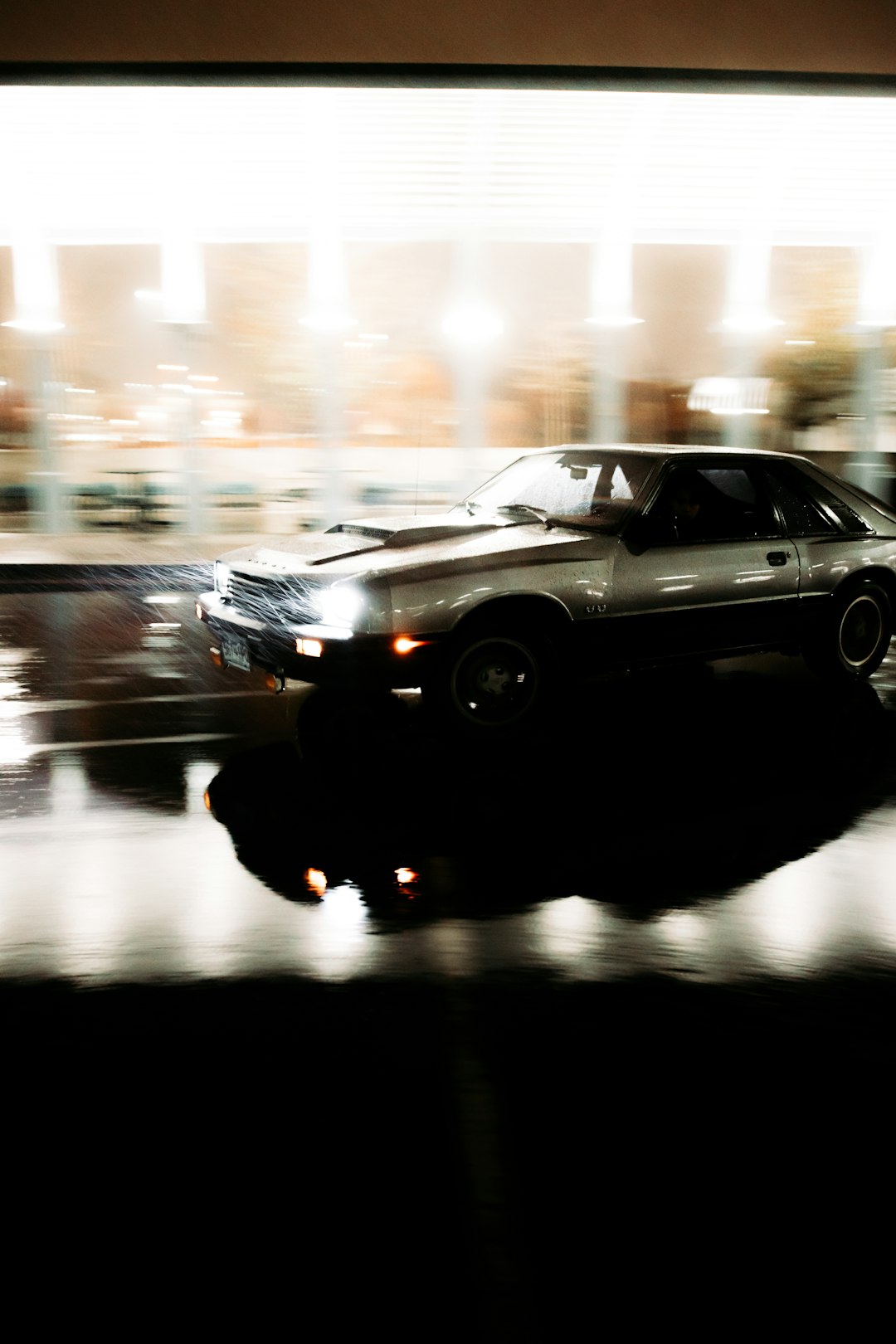 black chevrolet camaro on road during night time