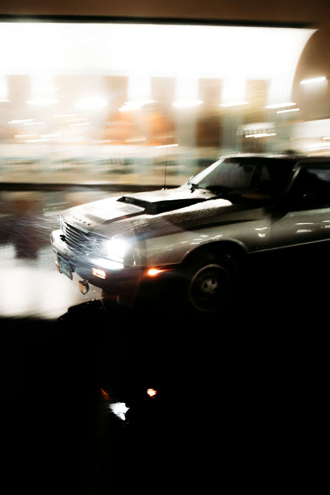 white car on road during night time