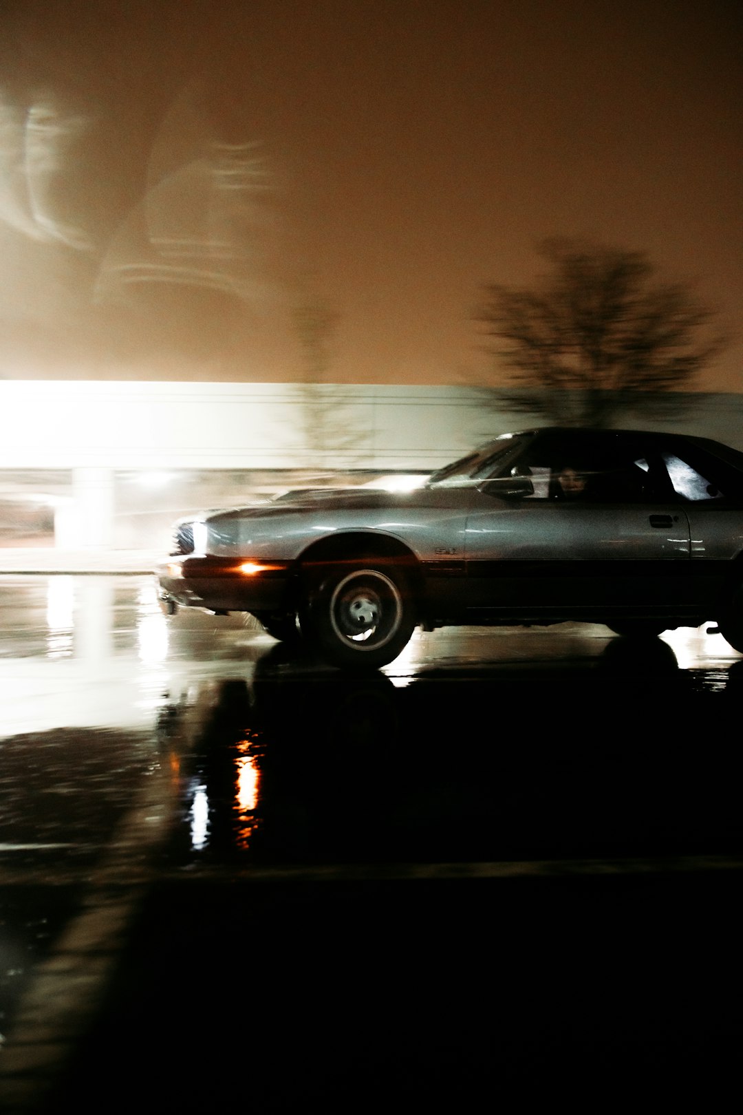 black sedan on road during daytime