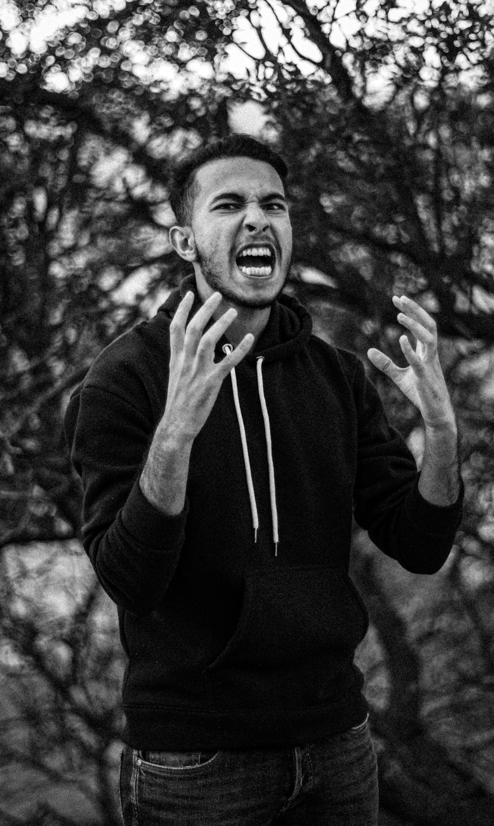 grayscale photo of man in black long sleeve shirt