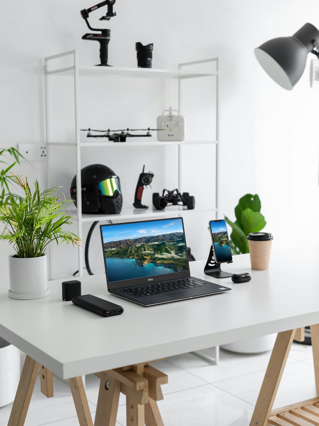 black laptop computer on white table