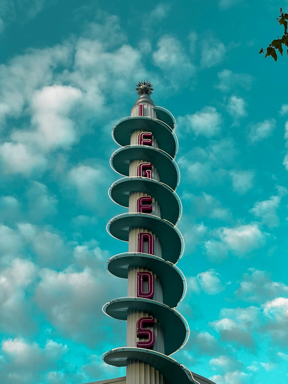 white and red tower under blue sky