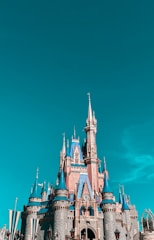 The grand facade of Buda Castle under a clear blue sky.