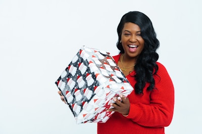 A joyful recipient opening a surprise gift.
