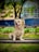 A happy dog sitting obediently next to its owner in a park.