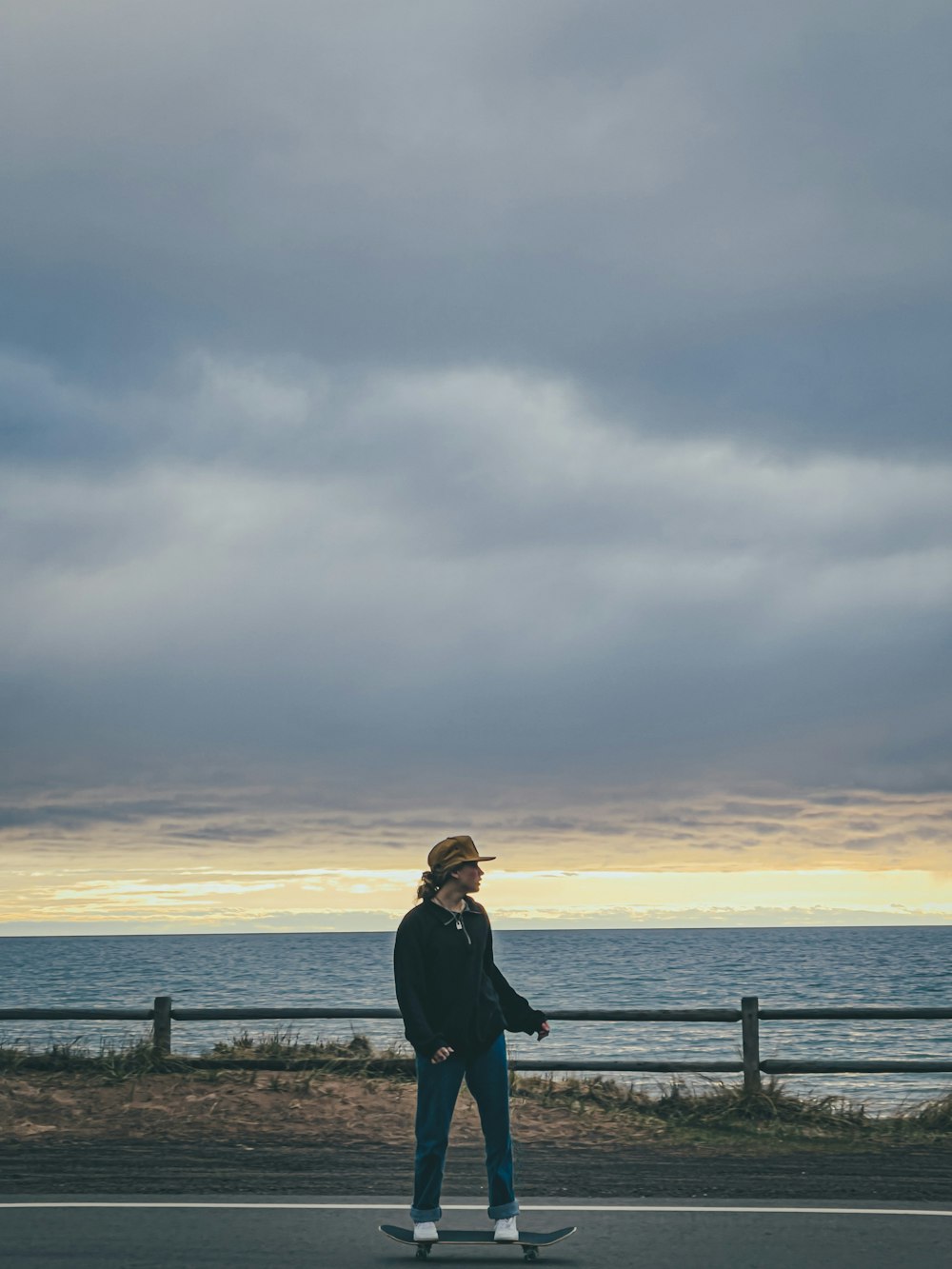 woman in black jacket standing on dock during daytime