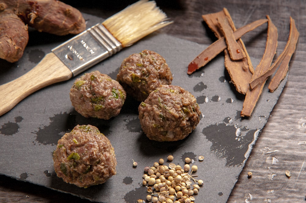 brown fried food on black surface