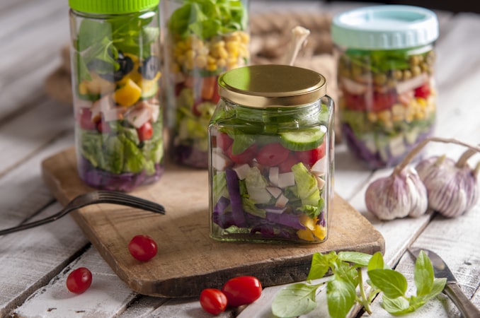 green and clear glass jar