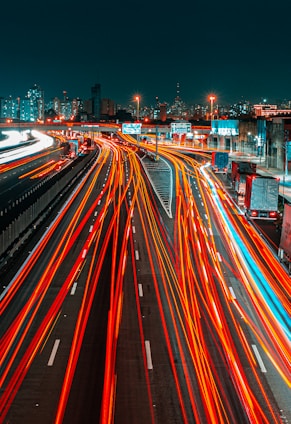 time lapse photography of cars on road during night time